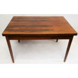 A 1960s Danish rosewood extending dining table, with a pull out leaf at each end, (121 x 80 x 76cm