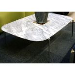 A modern cffee table with marble top and steel legs.