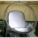 An Eero Sarrinen style hanging ball chair, perspex with silver faux leather cushions.