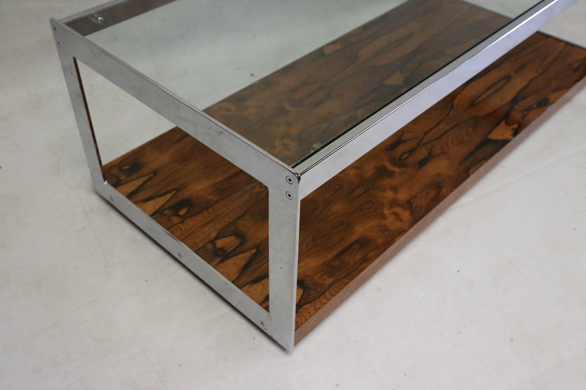 A 1970s Merrow Associates coffee table, glass top with rosewood base and chrome supports, (121 x - Image 2 of 2