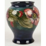 A William Moorcroft baluster shaped vase, in 'Hibiscus' pattern, stamped and painted marks under, (