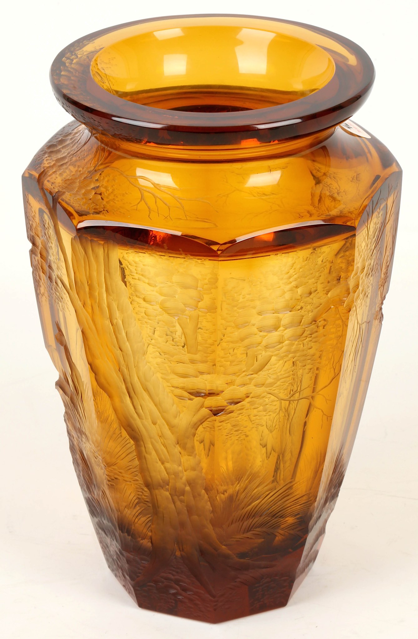 Attributed to Koloman Moser, a Bohemian Art Deco amber crystal glass vase, with deep engraved forest