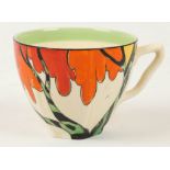 A Clarice Cliff Bizarre 'Honoloulou' tea cup, painted in colours, stamped marks under, (7cm high).