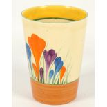 A Clarice Cliff Bizarre 'Crocus' pattern beaker, painted in colours, (11cm).