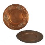 Two Arts and Crafts copper chargers, possibly Birmingham school, (28cm & 30cm diameter).