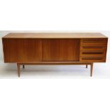 A 1960s Danish teak sideboard, double cupboard with sliding doors, four drawers, stamped B&N Made In