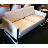 A Hans Wegner style white leather 2 seater sofa, on chrome supports