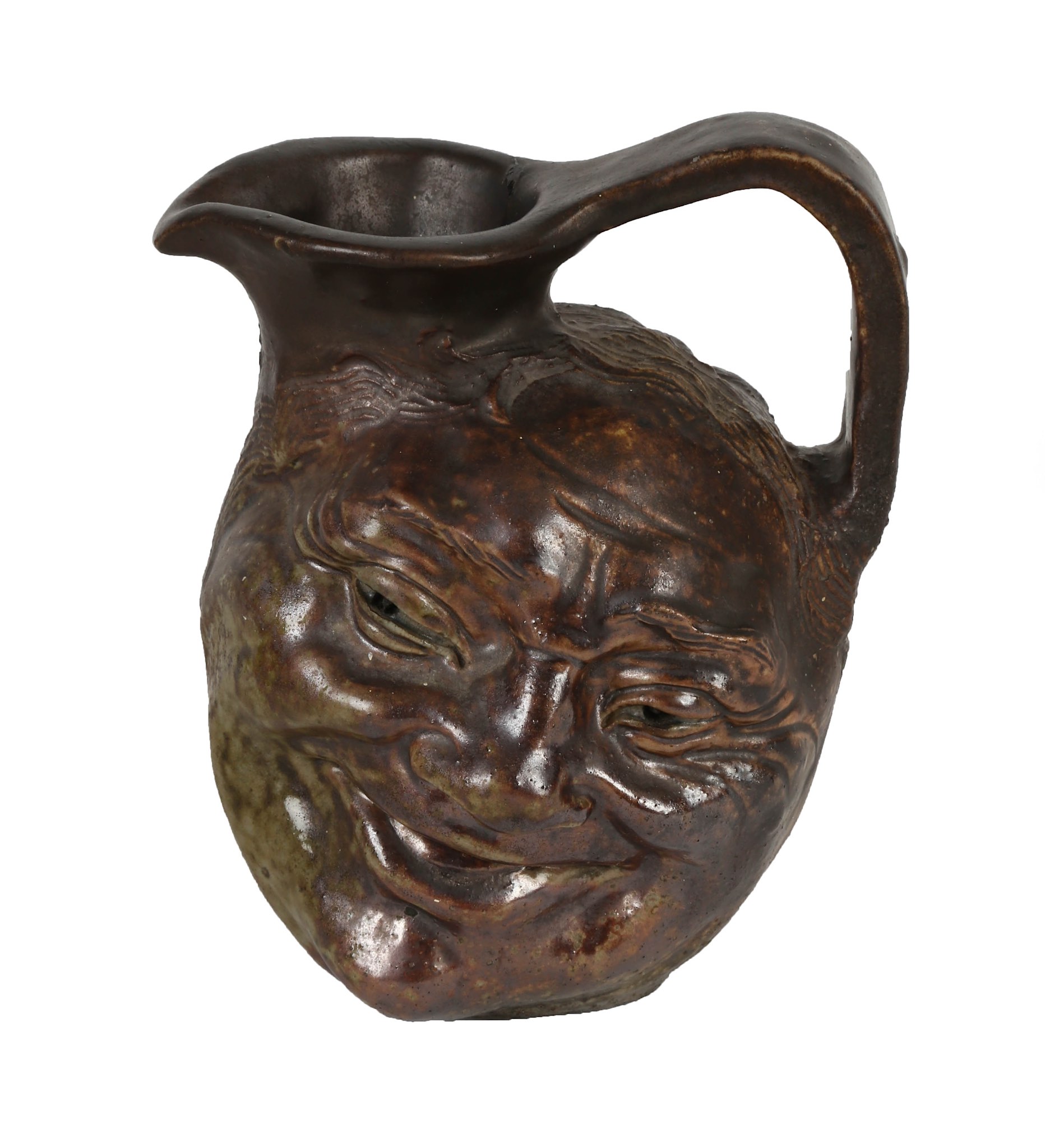 A Martin Brother's stoneware grotesque double-sided face jug, circa 1900, with dark brown and