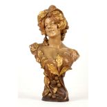 An Austrian Goldscheider bronzed terracotta bust of a neo-classical maiden, circa 1900, stamped