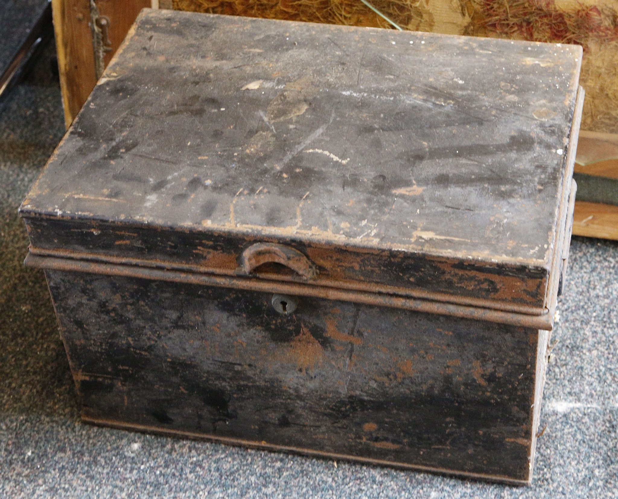 A tin trunk containing jars of collected British coinage