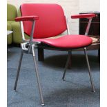 A set of four JSC Castelli chairs, designed by Giancarlo Piretti, red leather with arms.
