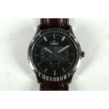A Dumont gents fashion watch, stainless steel case, black face with stainless batons and hands,