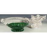 A blanc de Chine ceramic centerpiece in the form of an oval basket with ram's head mask handles(AF),