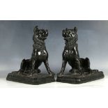 A pair of rare 19th century Jennings dogs, carved in serpentine marble, raised on naturalistic