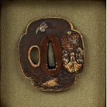 A JAPANESE TSUBA
Edo / Meiji
Carved in relief with gilt and silver, 7 x 6cm
Provenance: Previously