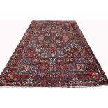 A Persian Bakhtiari rug, 30-40 years old, with traditional "garden" design, 4.7 x 3.16m.