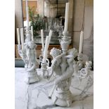 A pair of contemporary Italian white ceramic table lamps modelled with mermaids. (2)