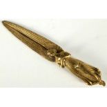 A late 19th century continental gilded bronze novelty letter opener cast in the form of a heavenly