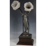 An Art Nouveau spelter lamp/figurine, rose petal shades, plant supports, reed box plinth, 48cm max.