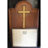 An early 20th century oak hanging Church sign mounted with a gold painted ascendant crucifix over an