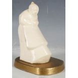 A French Art Deco cream crackle figure of a Russian woman on a gilded base, signed L. Hadii, base