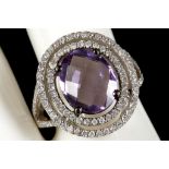 An amethyst and diamond cluster ring in 18ct white gold