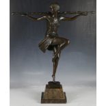 An Art Deco style bronze figure of dancing flapper girl, raised on a marble base