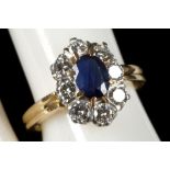 A French sapphire and diamond cluster ring in yellow gold shank