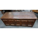 An oak 17/18th century blanket coffer, two plank  top, arch carving, geometric panels, barber pole