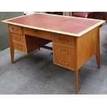 A post modernist blonde ash knee hole desk with an arrangement of six drawers supplied by Savitt's