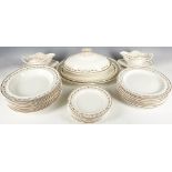 A Wedgwood creamware dinner service with scrolling foliate borders, comprises 12 dinner, 12 soup and