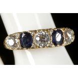 A sapphire and diamond five stone ring in 18ct yellow gold