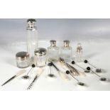 A small misc collection of H.M.S topped cosmetic bottles, together with a H.M.S. handled brush,