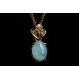 An opal pendant with a 3 diamond setting on a 9ct gold curb chain