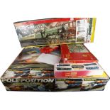 A Scalextric 'Pole Position' race car game in its original box, sold together with a Hornby '