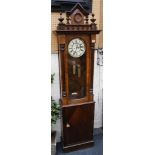 A 19th century Vienna type walnut clock, previously a wall clock, now remodelled a free standing