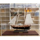 A wooden built model of a sailing boat, privately commissioned to celebrate 'Ten Years of Sailing