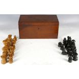 A Victorian mahogany cased complete set of wood and ebony chess game, some A/F