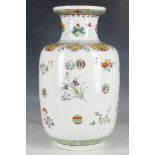 A Chinese famille rose vase, decorated in enamels with flowers and auspicious symbols, 36cm high