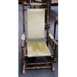 An American style stained beechwood rocking chair upholstered in green velvet