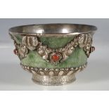 A jade bowl with white metal mounting and inlaid with some precious stones, 6cm