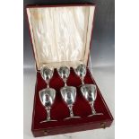 A set of silver goblets, gilded interior, floral banding, blank oval cartouche, bead neck, arch