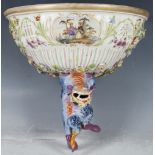 A 19th century Potschappel porcelain wall shelf, painted, the semi spherical shelf support with