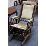 An American style stained beechwood rocking chair upholstered in green velvet