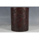 A Chinese bamboo brush pot, landscape carving with God and fawn, inscription to reverse, mid 20th