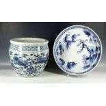 A 20th Century Chinese jardinere, blue designs of dragons and clouds sold together with a charger