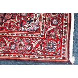 An antique Persian kashan with central Red medallion on blue field