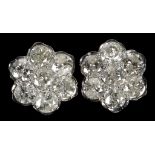 A pair of 18ct white gold and diamond floral clust