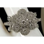 An 18ct white gold and diamond set multi-cluster d