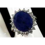 An 18ct white gold, sapphire and diamond cluster r